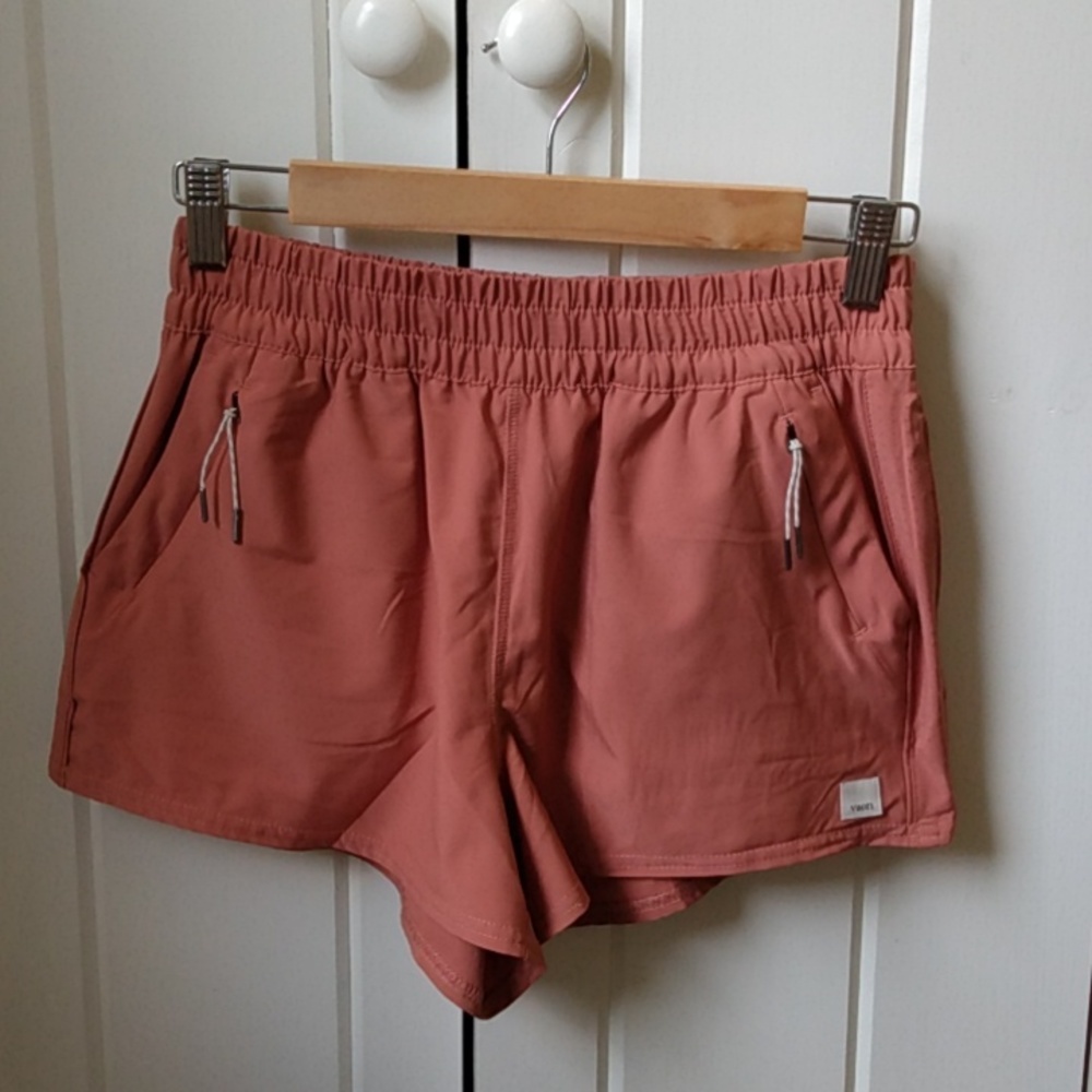 Vuori Women's Athletic Shorts in Rust